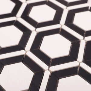 Vita och svarta sexkantiga marmormosaikplattor