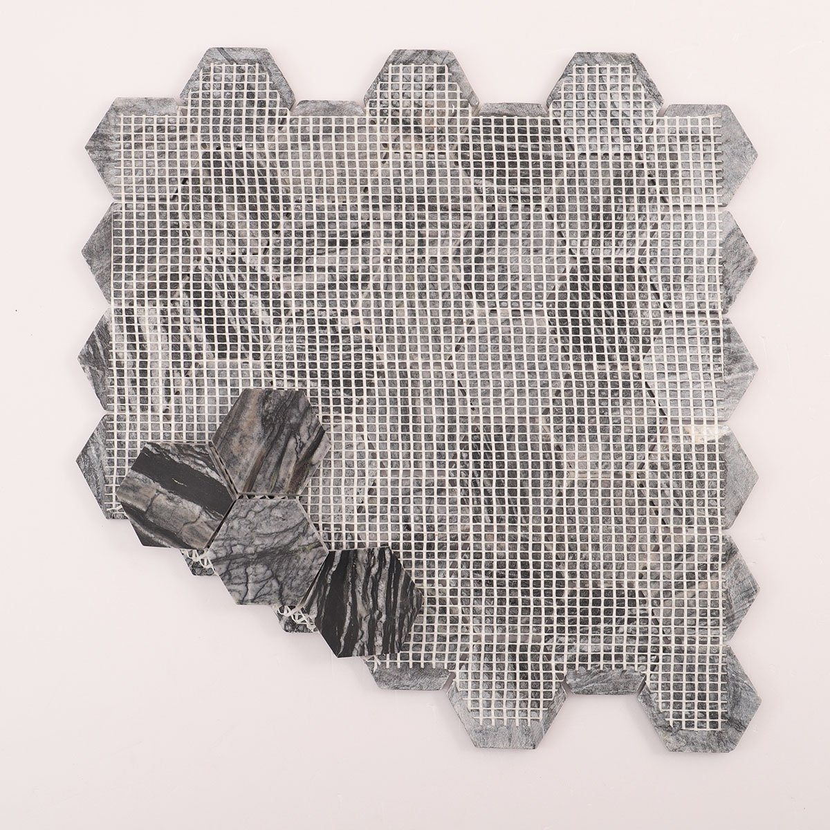 Back side of dark grey hexagon marble mosaic tiles, folded