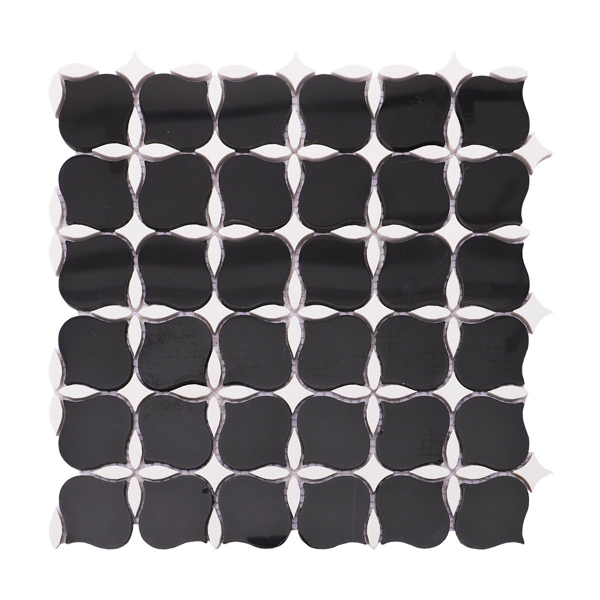 Full view of black and white stone mosaic tile with a unique floral design and glossy finish