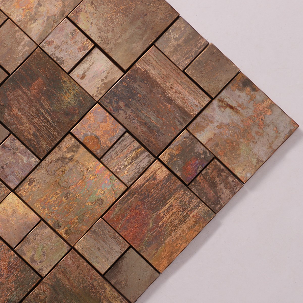 Close-up of 3D copper metallic mosaic tile.