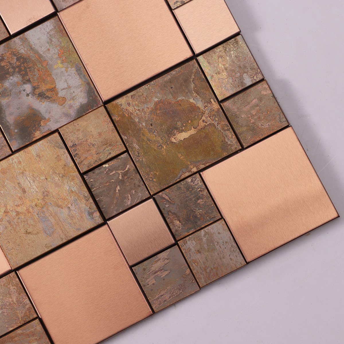 Detailed close-up of 3D copper and stainless steel tiles