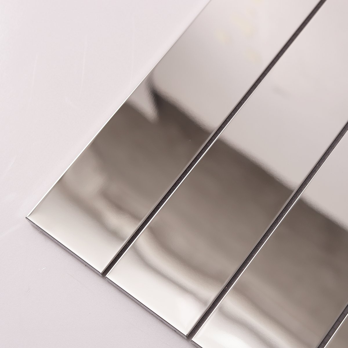 Detailed view of Mirrored Rectangle Strip Metal Silver Mosaic Tiles, showing reflective surface