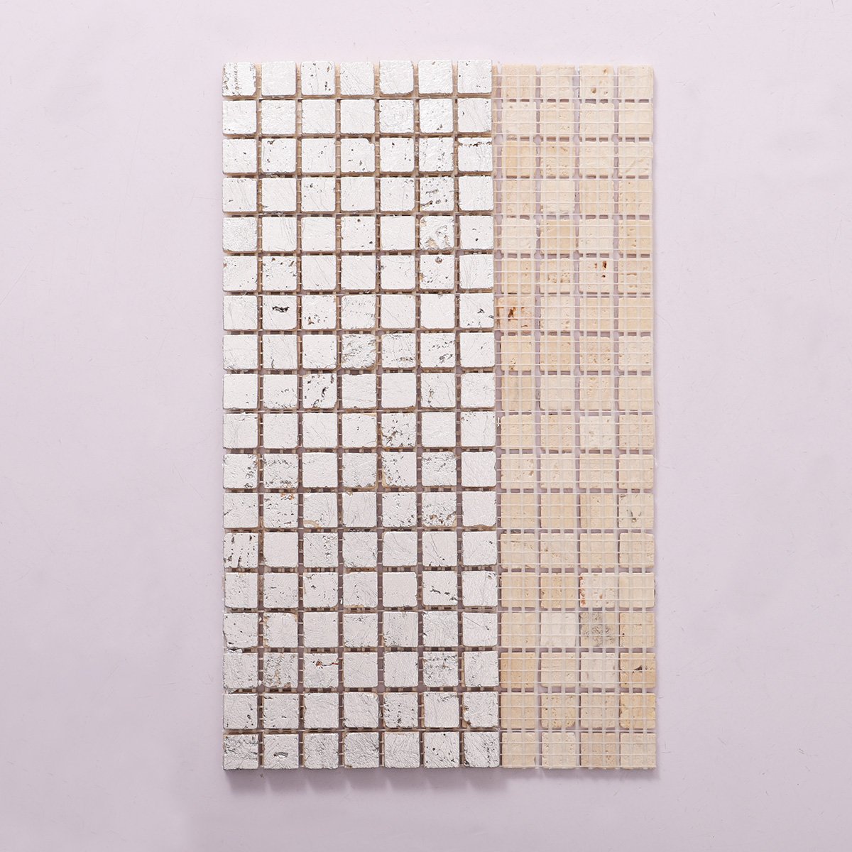 Back side of silver foil travertine mosaic wall tiles, folded.