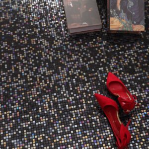 Mini Black Square Iridescent Glass Mosaic Tiles on the floor, with red high heels and books