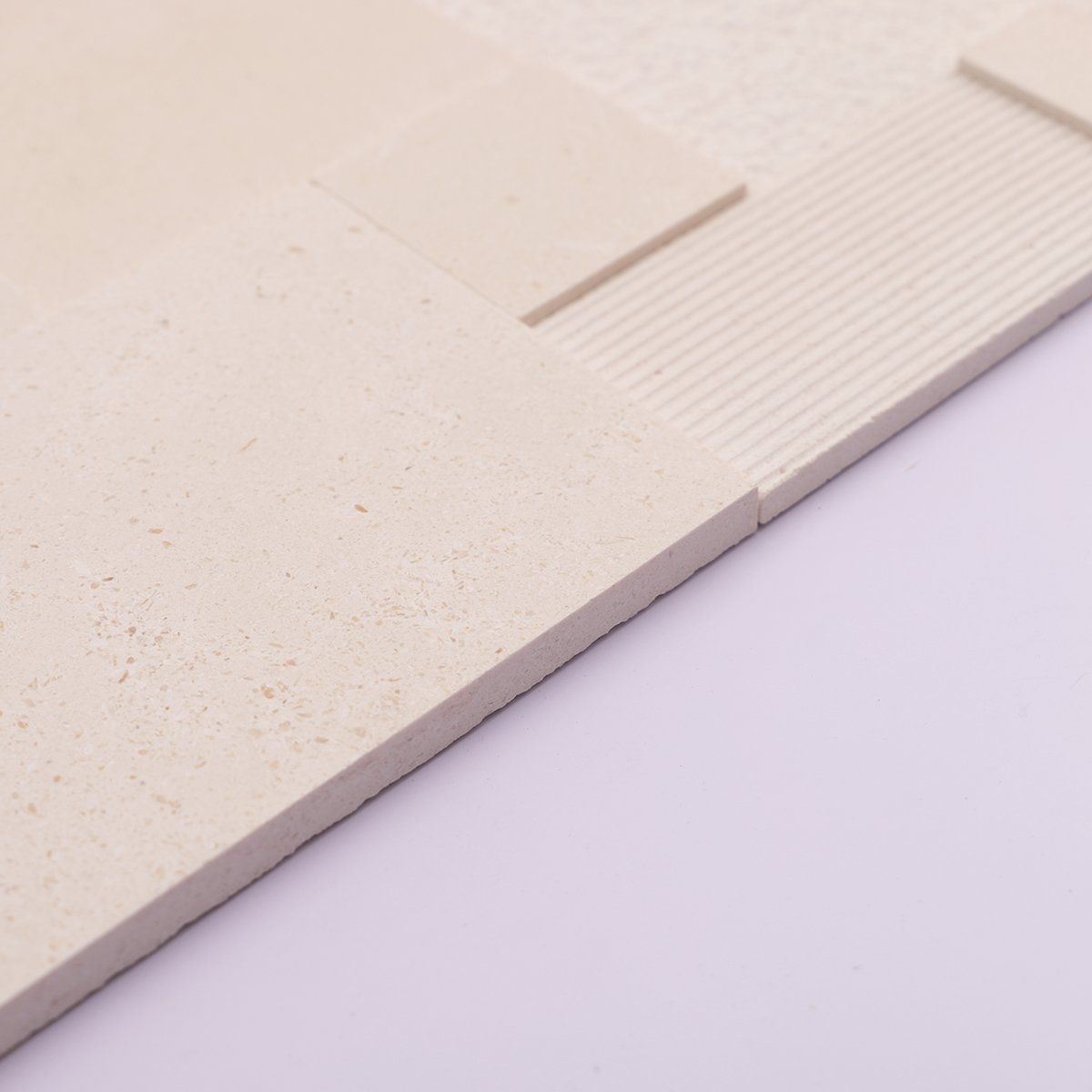 Side view showing the thickness of 3D beige marble mosaic tiles