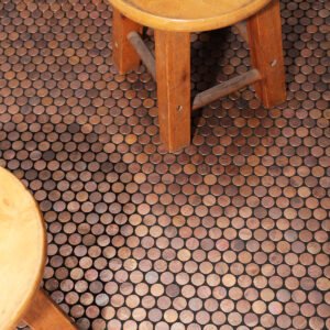 Penny rounds copper mosaic tiles on the living room floor