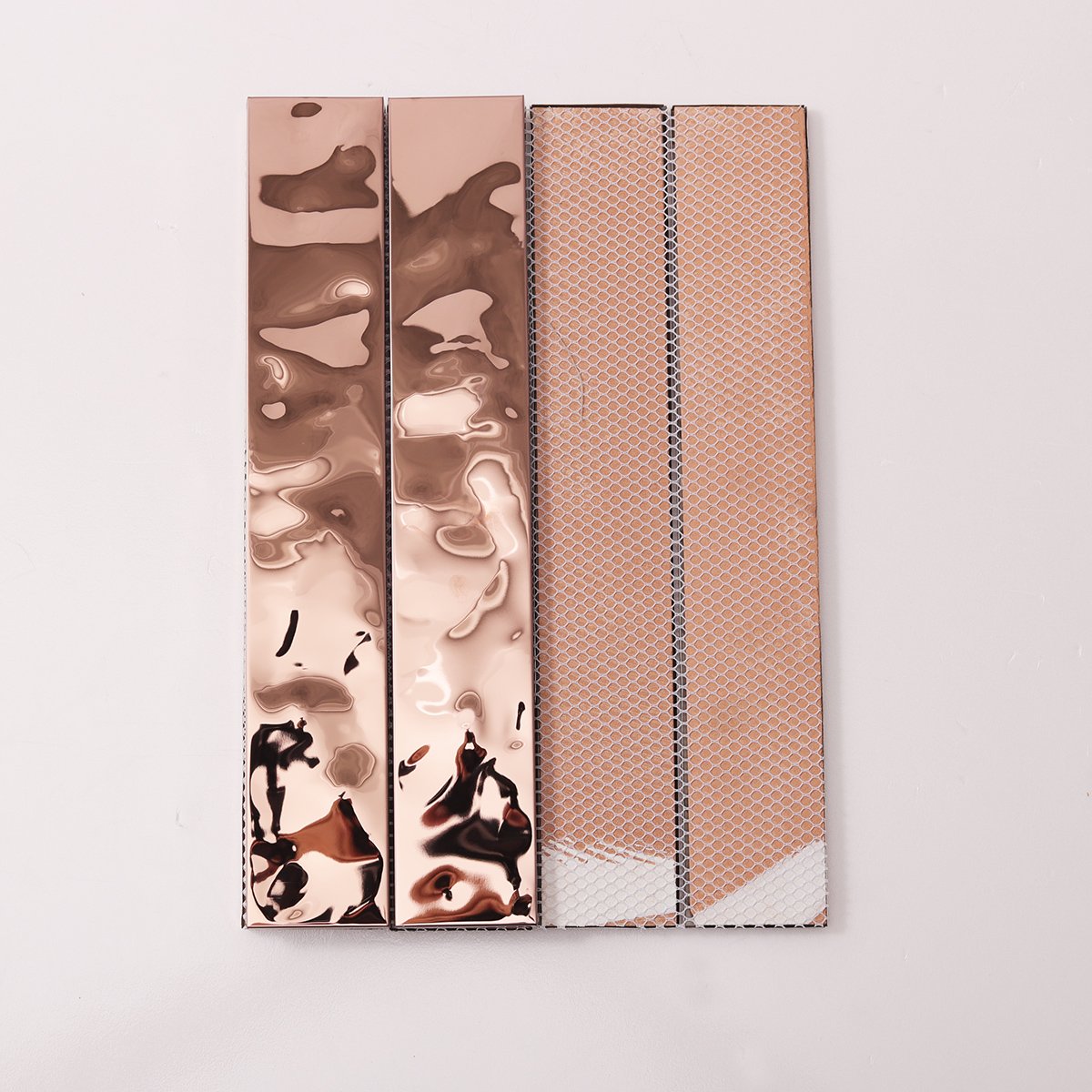 Side view close-up of Rose Gold Stainless Steel Brick Mosaic Tiles, edge detail