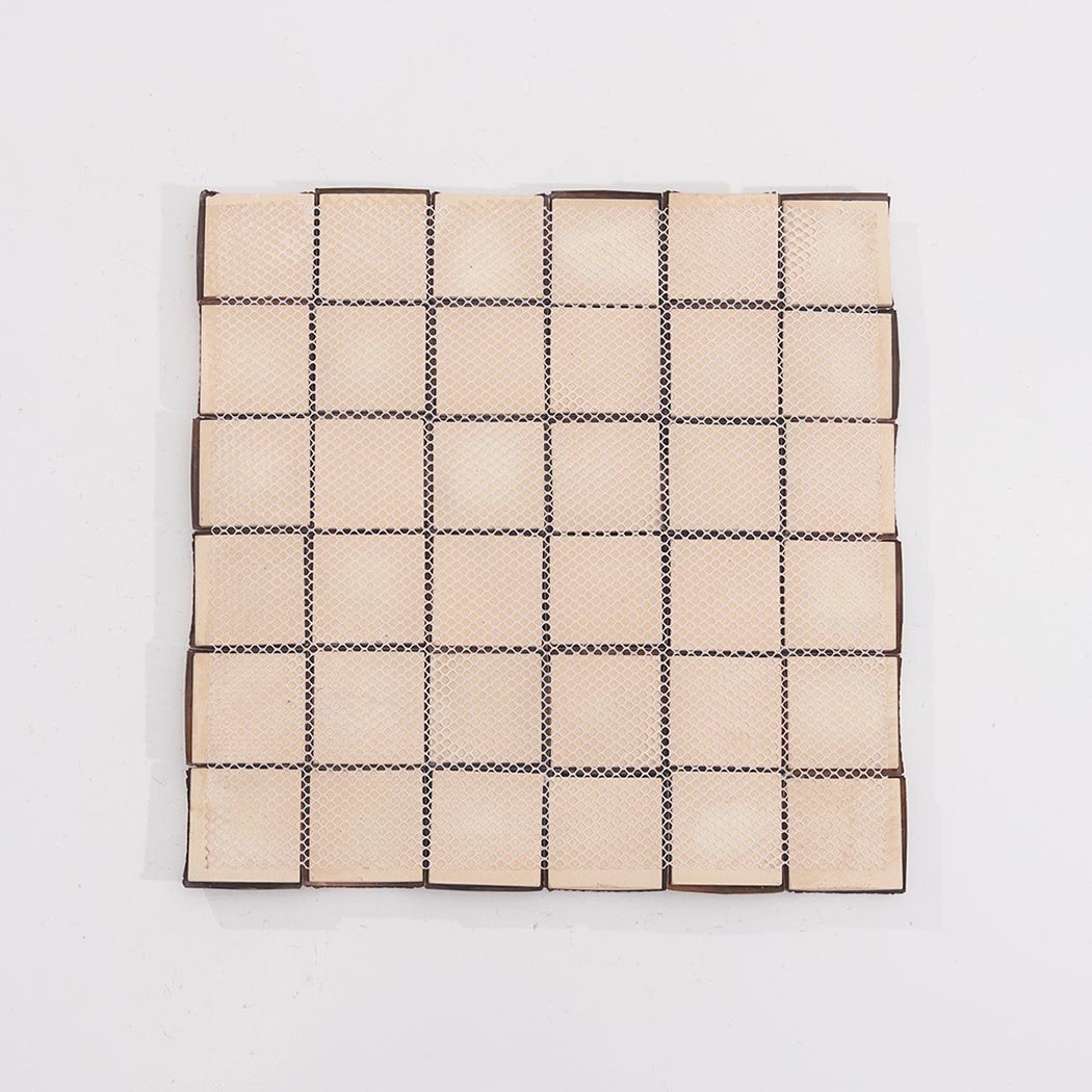 Back view of antique copper 3D square metal mosaic tile sheet with mesh backing