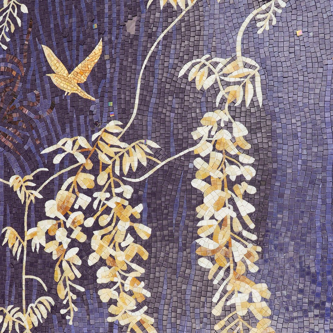 Blue and gold floral bird mosaic mural detail with small square tiles
