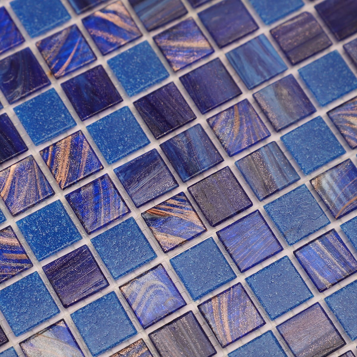 Close-up of blue mosaic tiles with a mixture of glossy and matte finishes