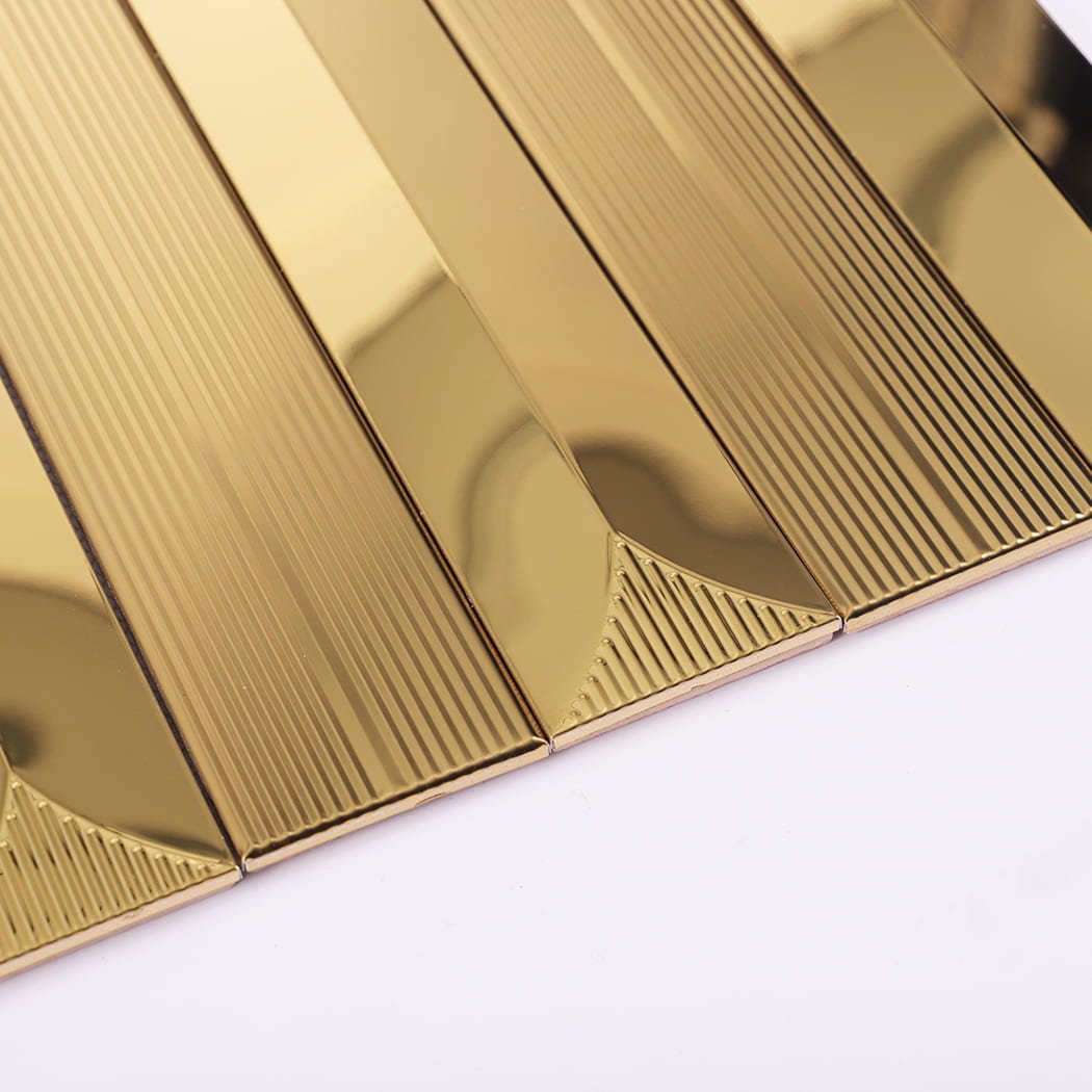 Edge detail of gold wall tile showing precise alignment and reflection