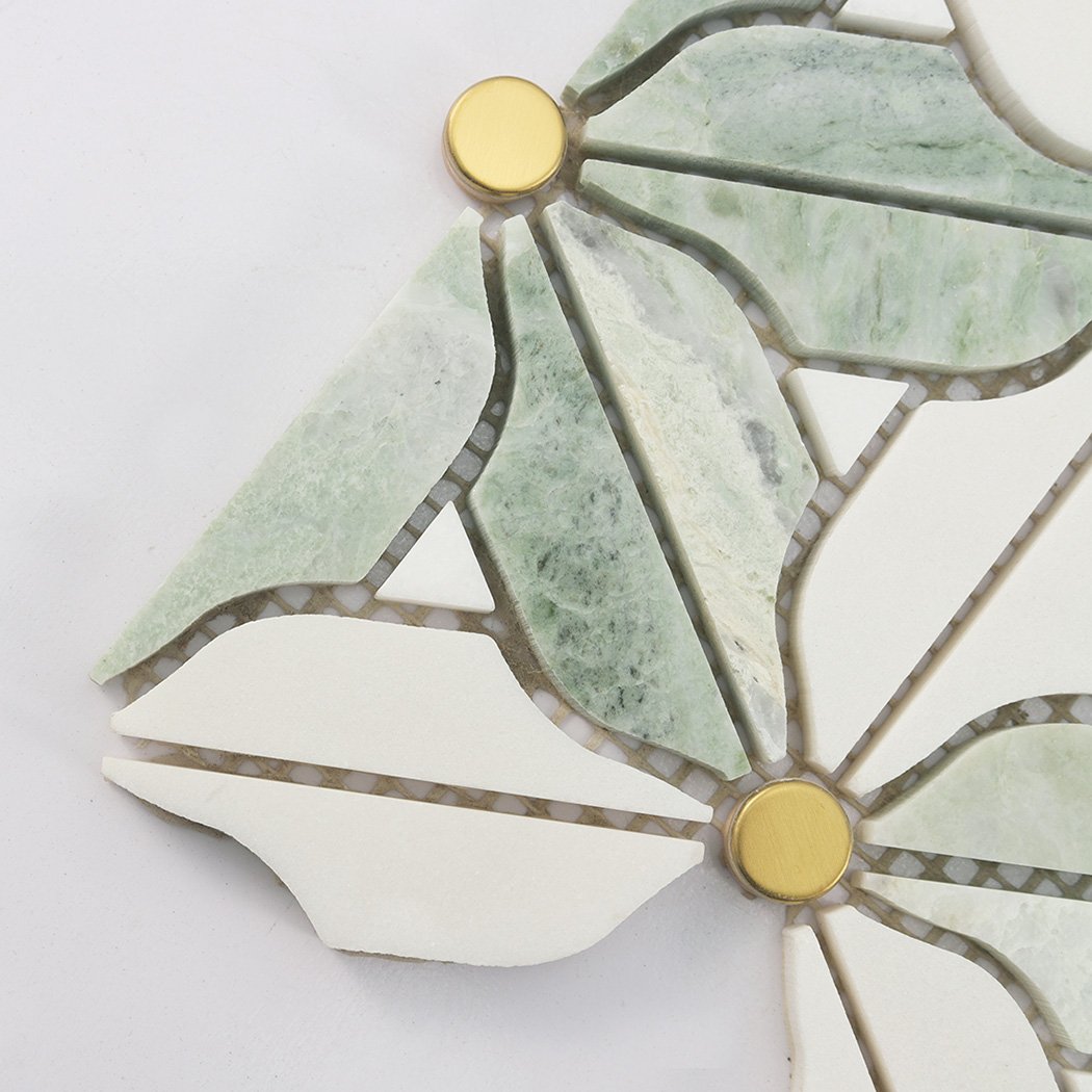 Close up of green marble daisy mosaic tile with gold stainless steel center dots
