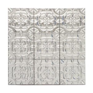 Full view of mirror silver stainless steel mosaic sheet with raised floral relief pattern.