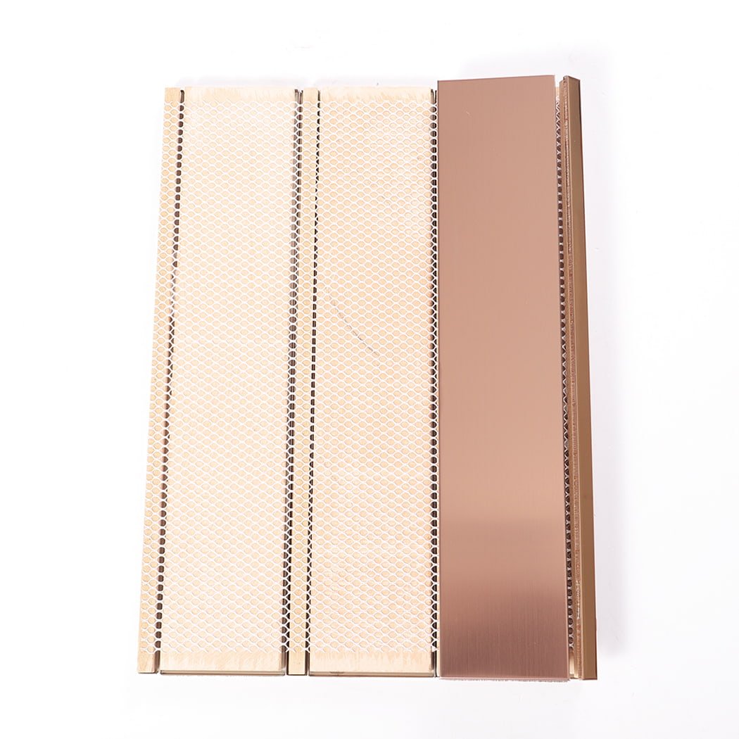 Back view of rose gold metal tiles showing honeycomb backing