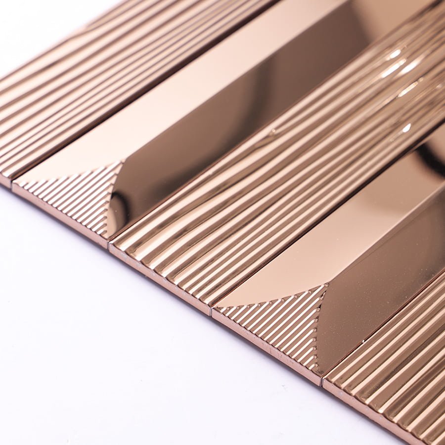 Angled edge view of rose gold striped metal tile showing texture and reflection.