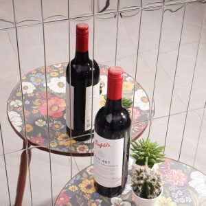 Decorative scene showing silver mirror tiles reflecting wine bottles and plants