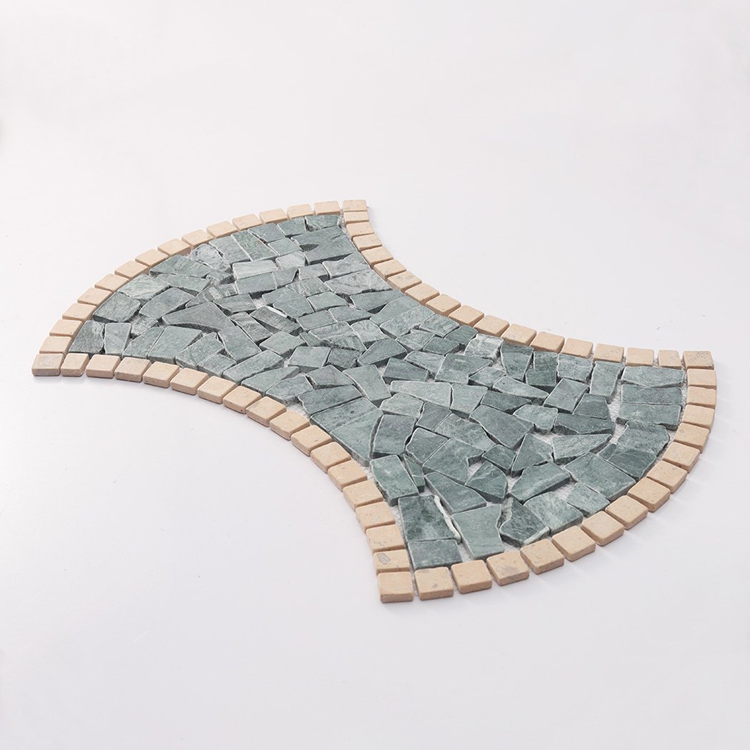 Angled view of curved green marble pebble mosaic tile sheet with beige trim