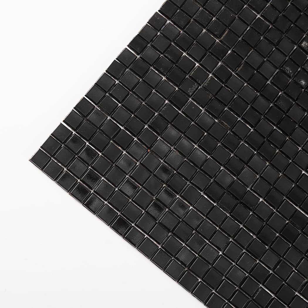 Diagonal corner close-up of black mini glass mosaic tiles