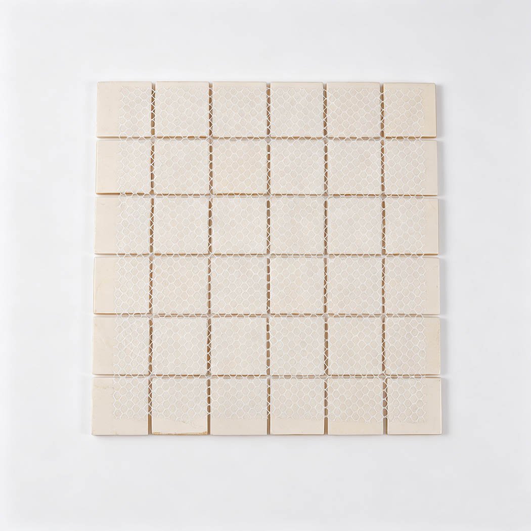 Back view of bright yellow square glass mosaic tile sheet with white mesh backing
