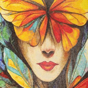 Close-up mosaic mural of a woman's face with a butterfly mask