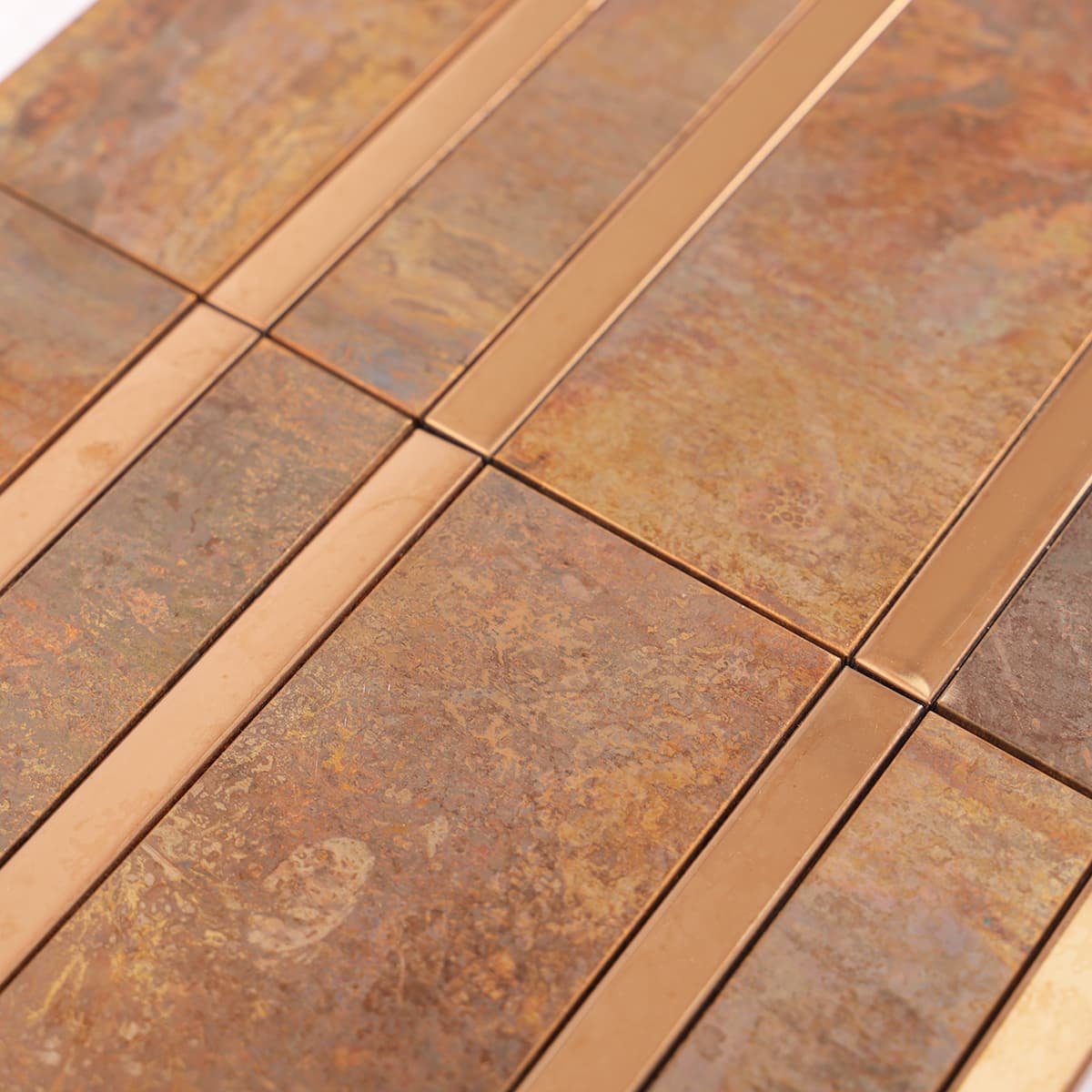 Rustic copper mosaic tile with shiny stainless steel strip details