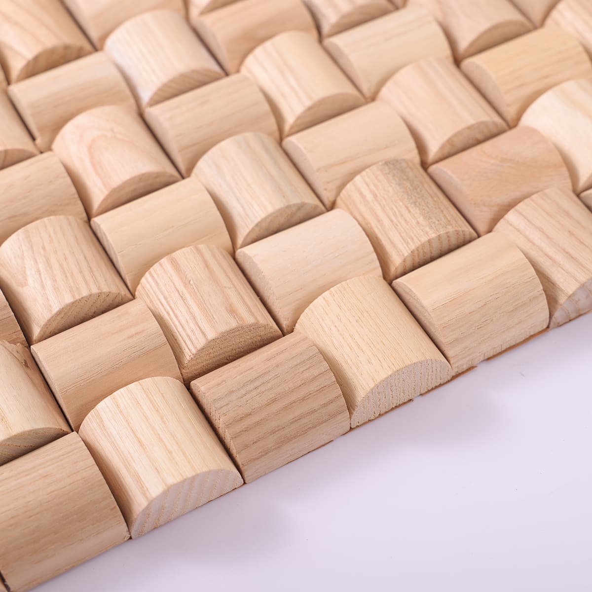 Curved wood mosaic tiles showing raised 3D block shape