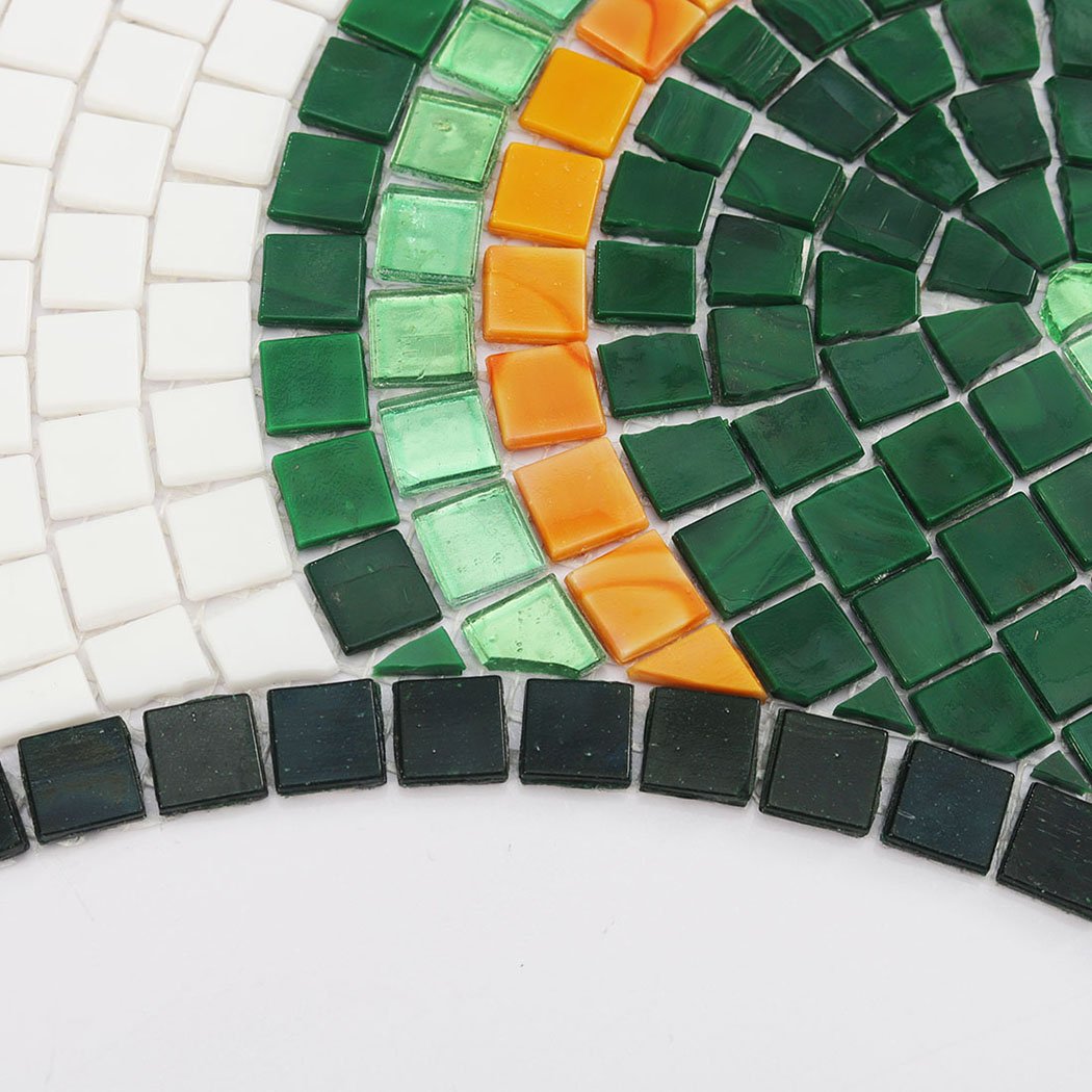 Close-up of dark green square glass tiles on a mosaic border.