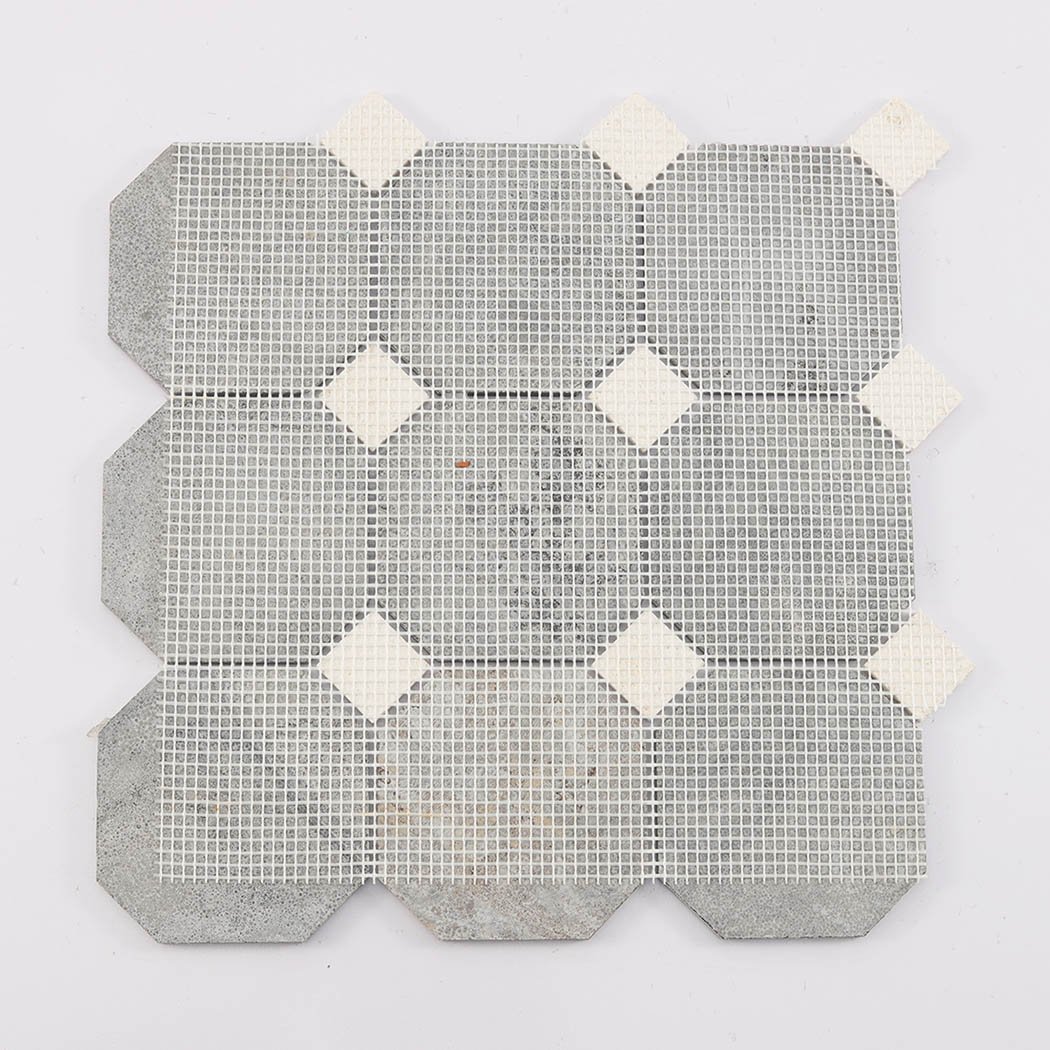 Back view of deep brown octagon mosaic tile showing mesh mounted backing