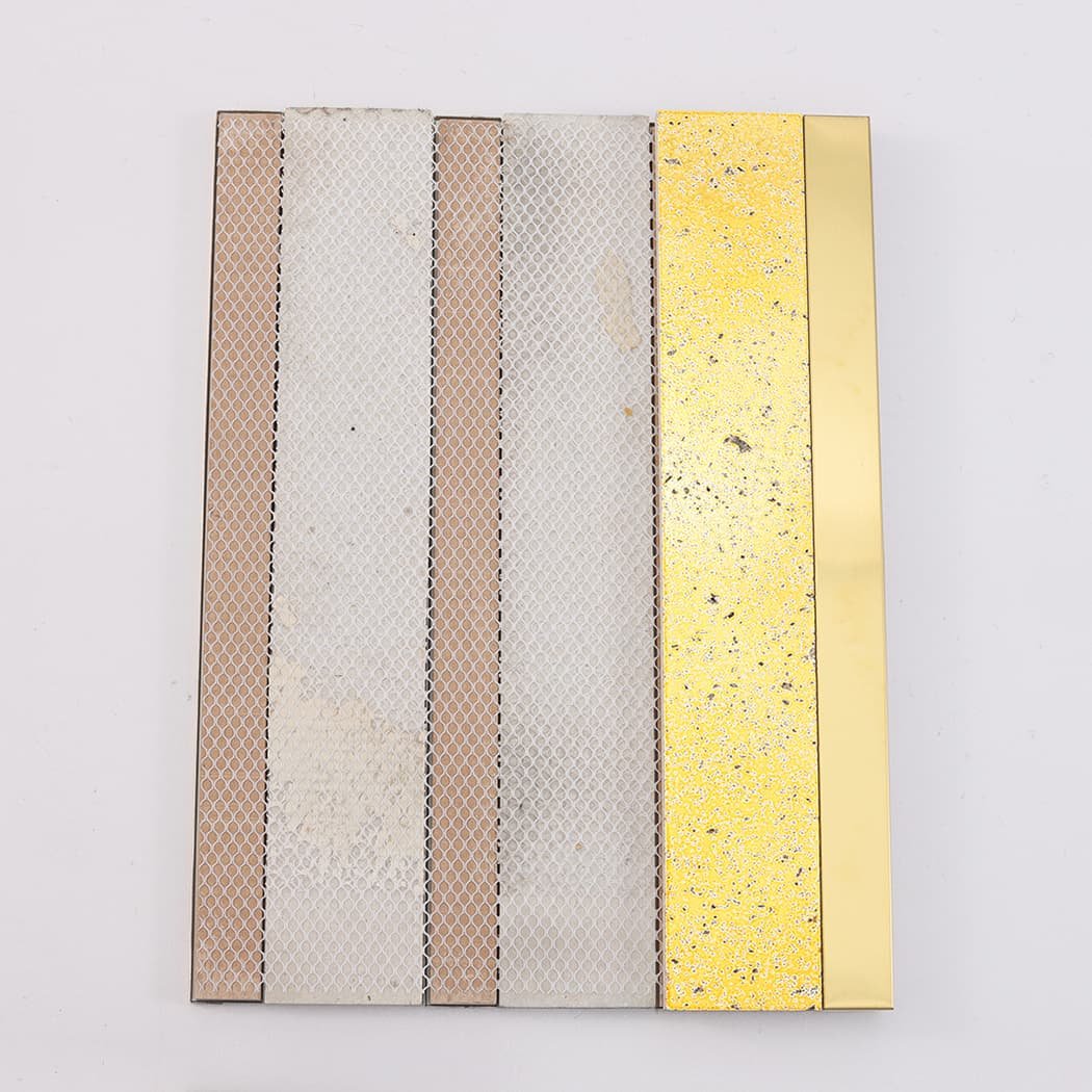 Back view of gold electroplated stone and brushed metal mosaic with mesh backing