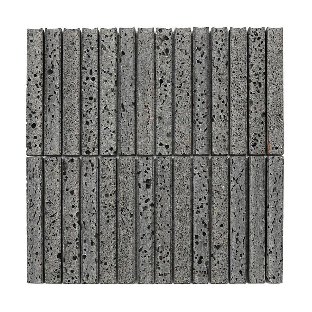 Full sheet of gray lava stone linear mosaic tile with porous rectangular strips