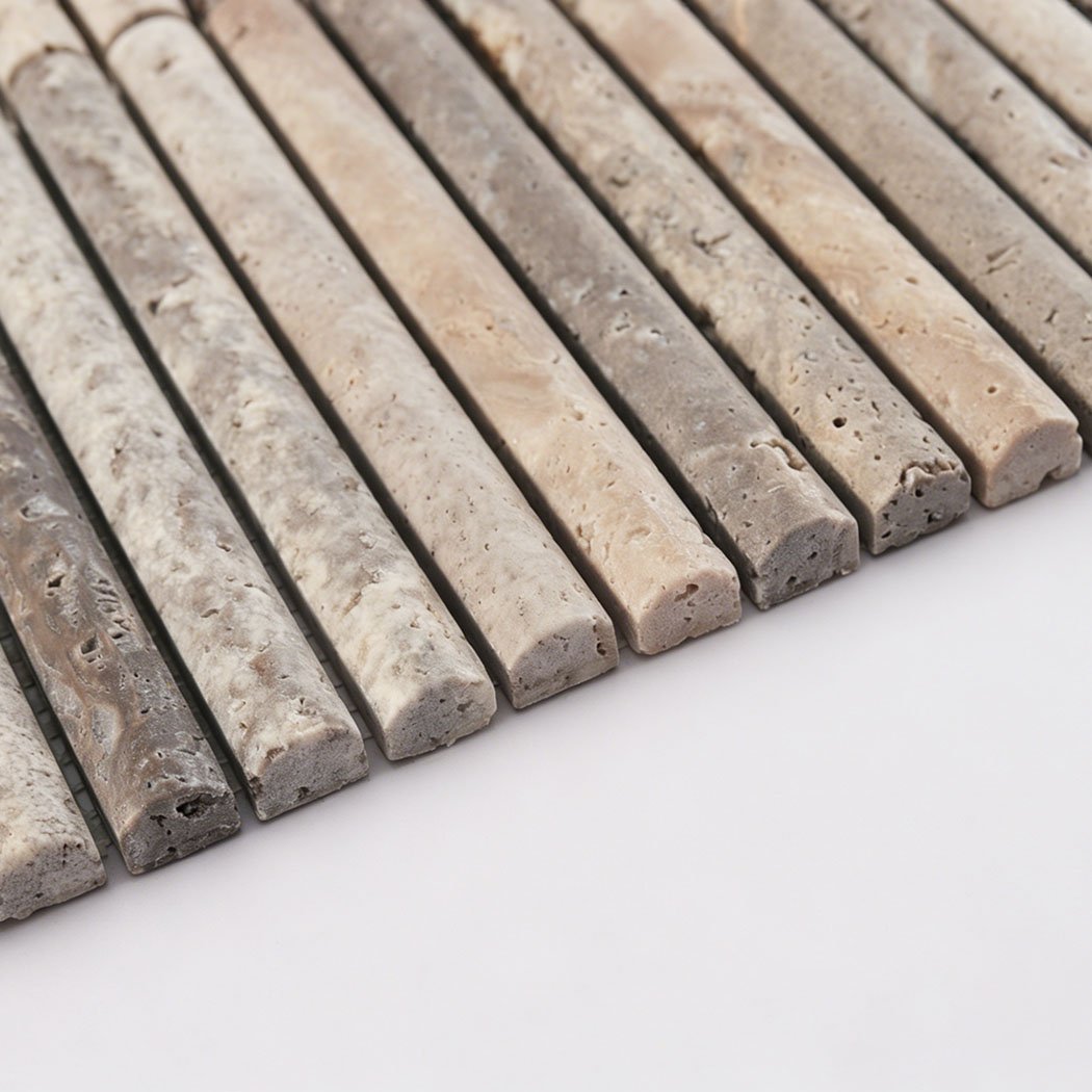 Edge detail of gray travertine rounded strip mosaic tile with porous stone texture