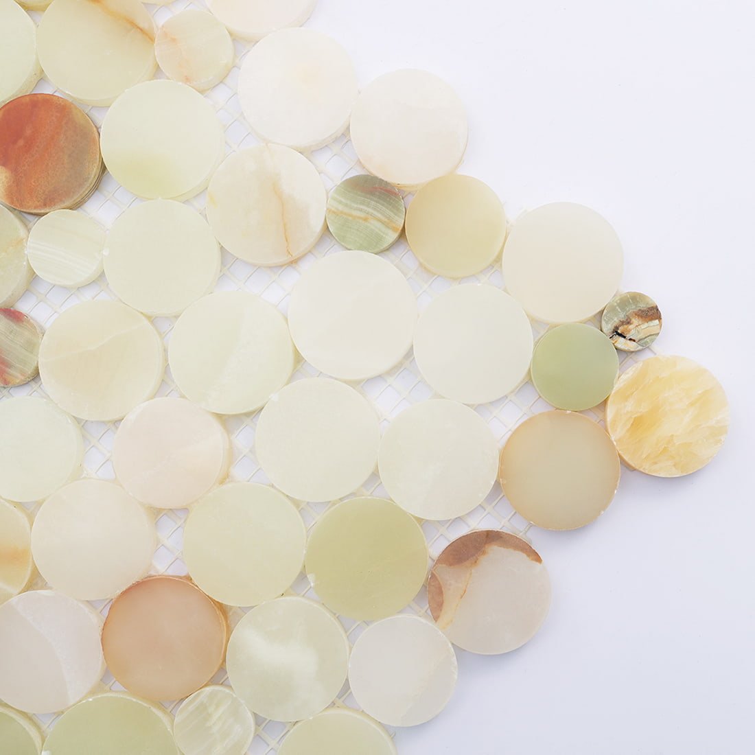 Close-up of green beige marble round mosaic with natural veins