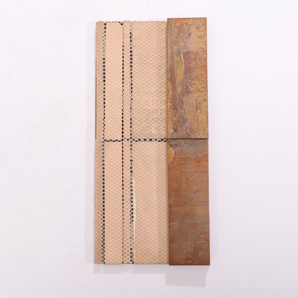 Mesh backing detail of copper and stainless steel mosaic tile