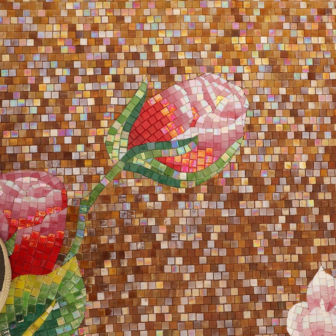 Red peony bud on a bronze brown mosaic tile background