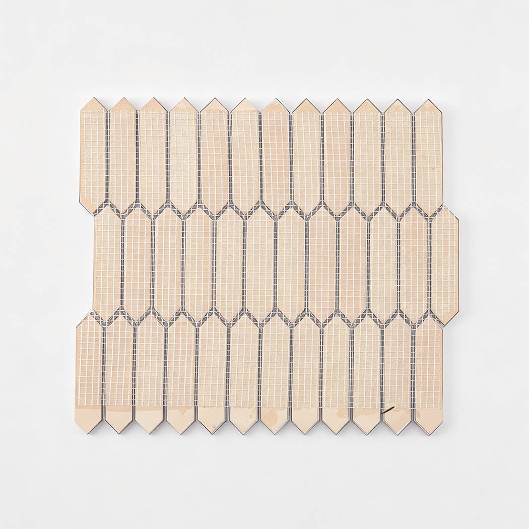 Rear fiber mesh backing on rose gold aluminum picket tile sheet