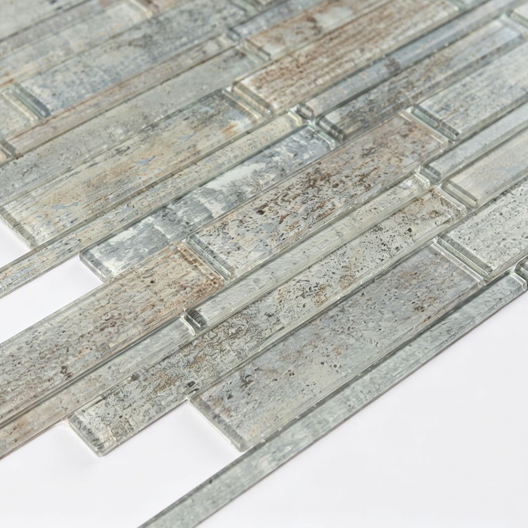 Close detail of weathered gray beige glass strips with clear raised edges