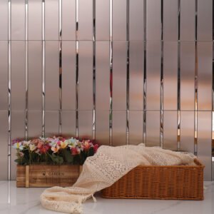 Silver stainless steel linear mirror mosaic wall with basket and flowers.