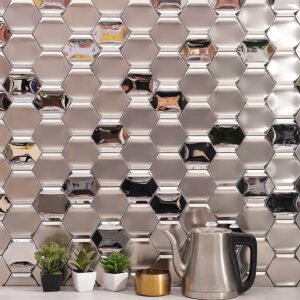 Full wall view of silver stainless steel hexagon metal mosaic backsplash.