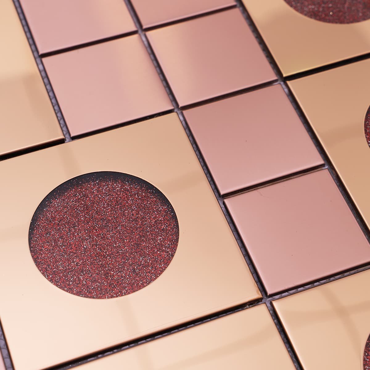 Texture view of rose gold metal and glitter circle glass mosaic