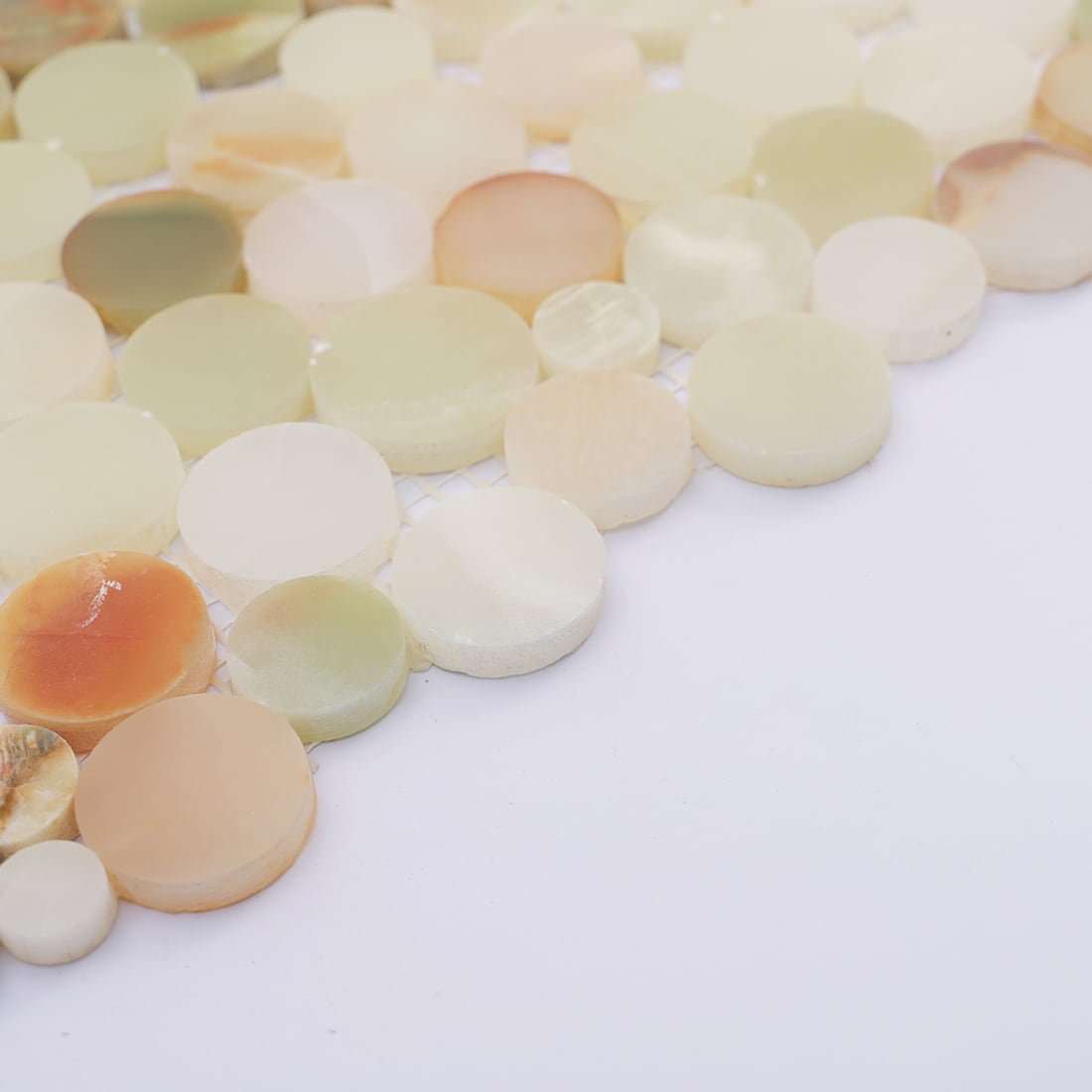 Edge detail of round marble mosaic showing fine polish and color mix