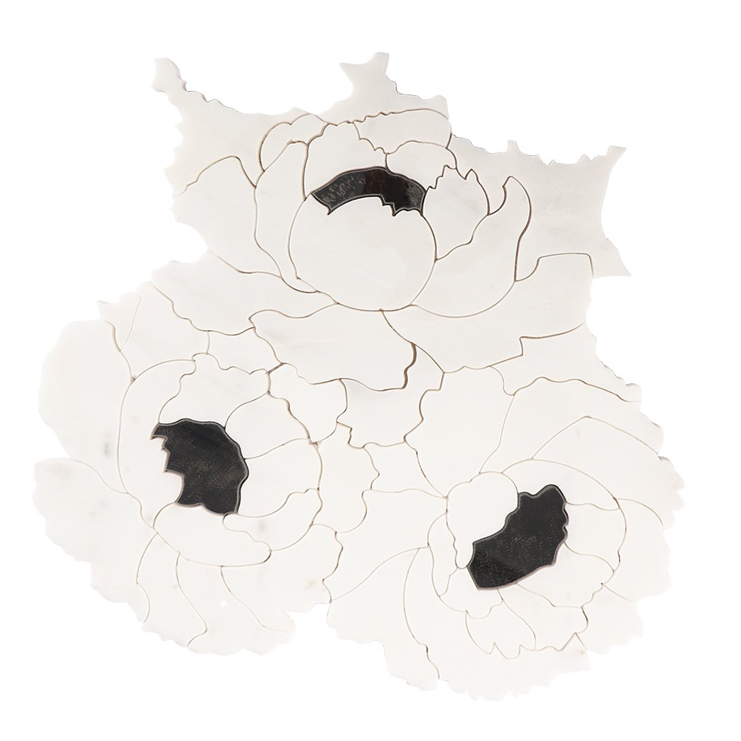 Front view of white flower-shaped marble mosaic tile with black stone accents.