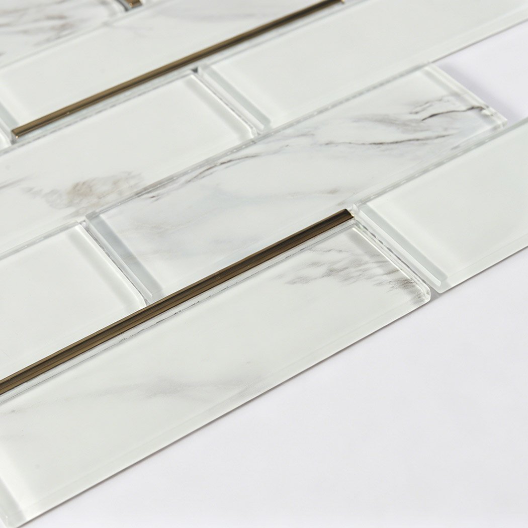 White Marble Glass Subway Tile In Staggered Pattern With Slim Gold Line Accents