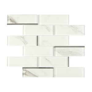 White marble glass subway tile in staggered pattern with slim silver accents