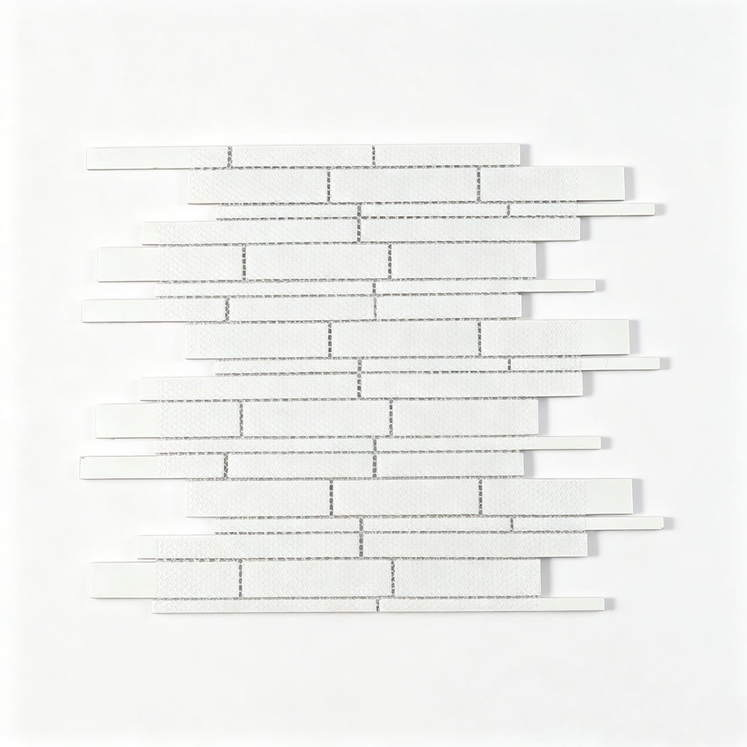 Back view of linear glass mosaic tile sheet with white mesh mounted backing